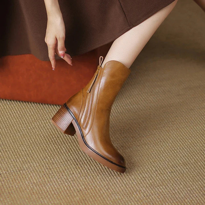 Chic women's black ankle boots, combining elegance with comfort for stylish fall & winter fashion. Versatile footwear.