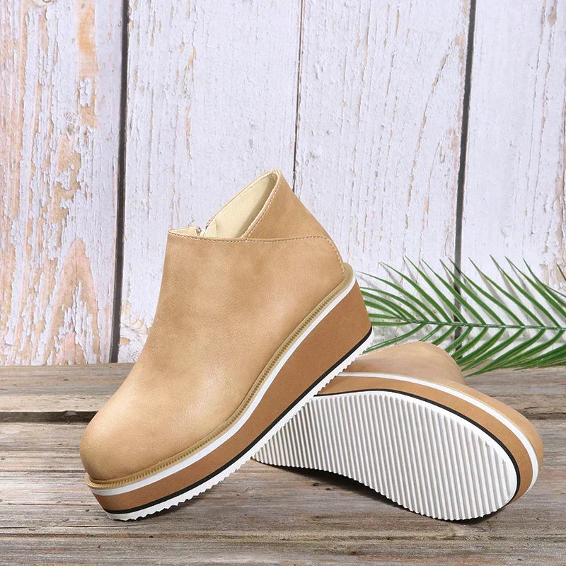 Supportive platform ankle boots for women, orthopedic design for superior comfort.