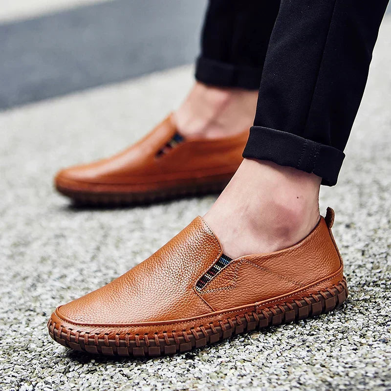 Men's black slip-on shoes with flexible sole, ideal for daily walking and easy wear comfort.