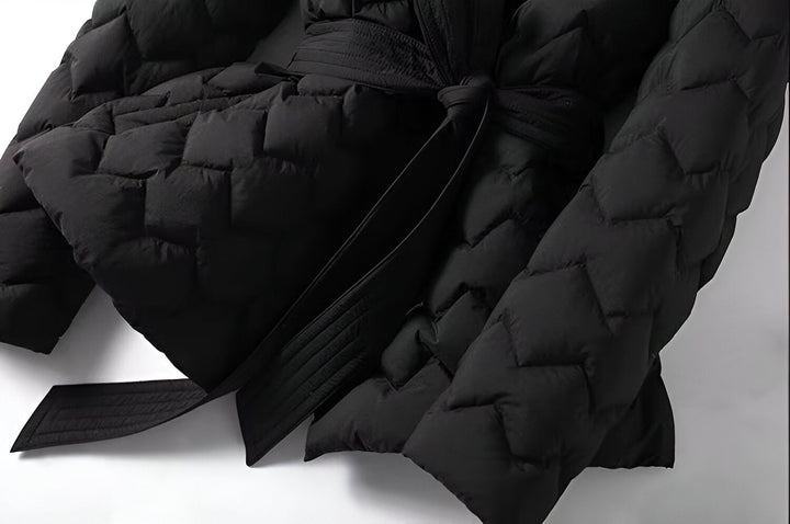 Fashionable women's padded winter coat, offering elegant style & essential warmth for cold seasons.