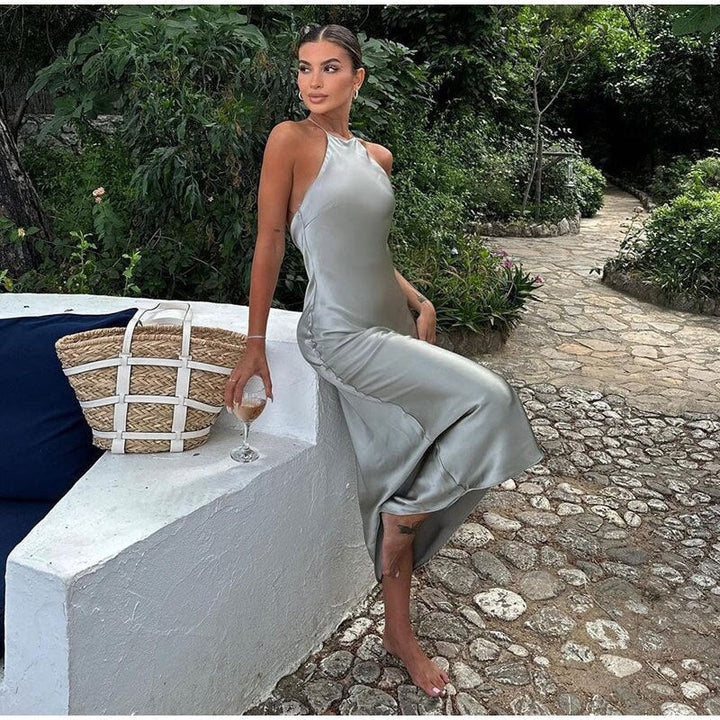 Flowing sleeveless wrap maxi dress for women, featuring a sophisticated open back design.
