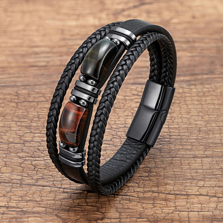 Detailed close-up of a men's braided tiger eye and stainless steel wrist bracelet accessory.