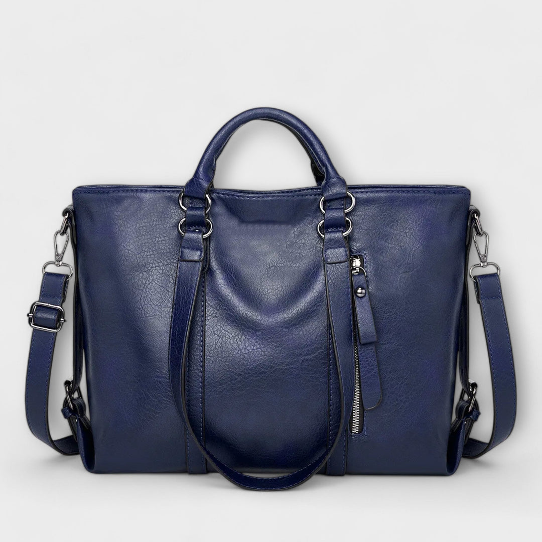 Front view of a women's large capacity leather shoulder bag, showcasing its elegant design and spacious interior.