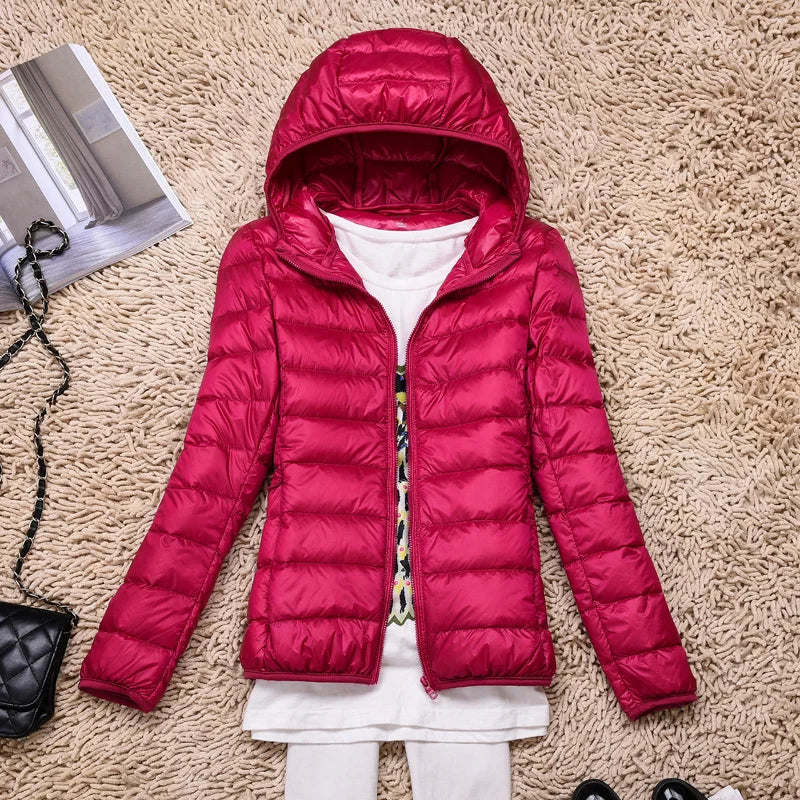 Everyday comfortable women's insulated hooded jacket. Lightweight, weather-resistant winterwear.
