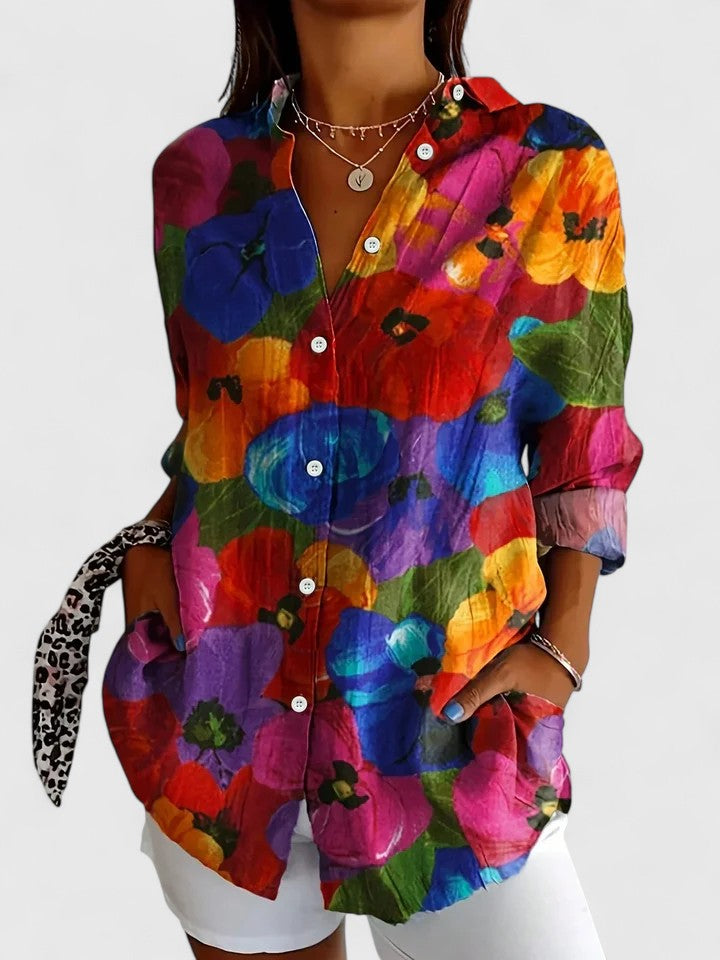 Vibrant floral print women's blouse. A stylish statement piece for a sophisticated and comfortable fashion look.