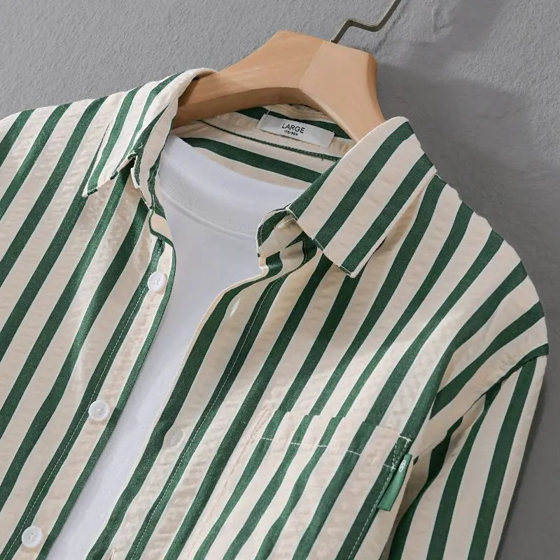 Versatile men's long-sleeve striped button-down shirt. Effortless style for casual or formal occasions. Classic.