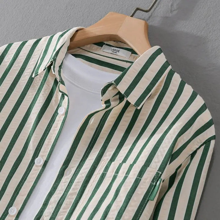 Versatile men's long-sleeve striped button-down shirt. Effortless style for casual or formal occasions. Classic.