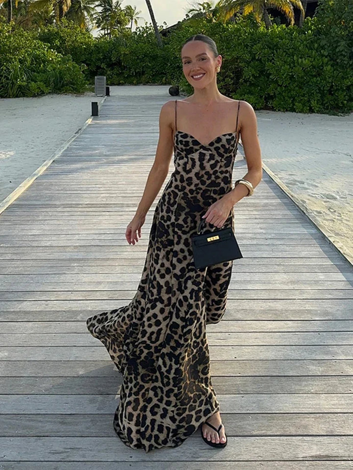 Elegant women's leopard print maxi dress with a flattering fit and flare silhouette, perfect for evening or party wear.