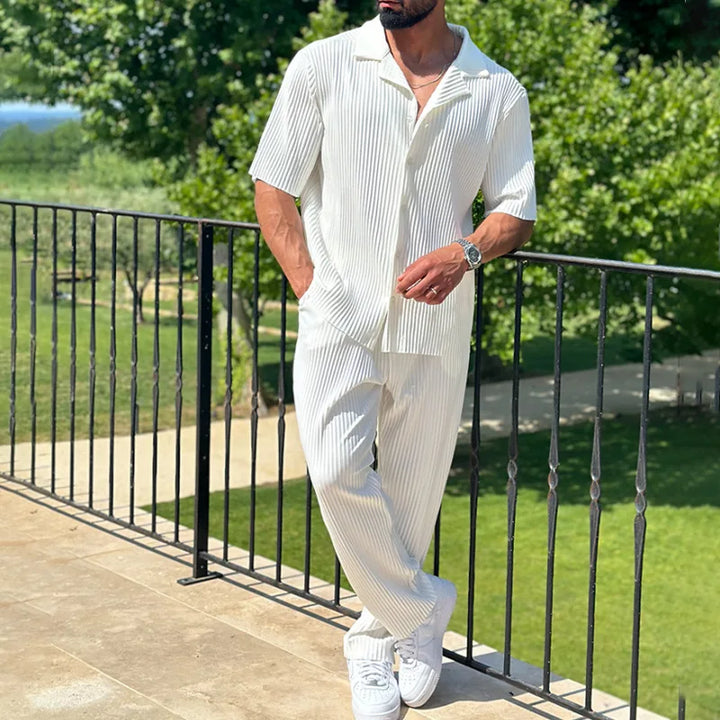 Men's relaxed fit pleated two-piece set, featuring a short sleeve camp collar shirt and matching trousers.