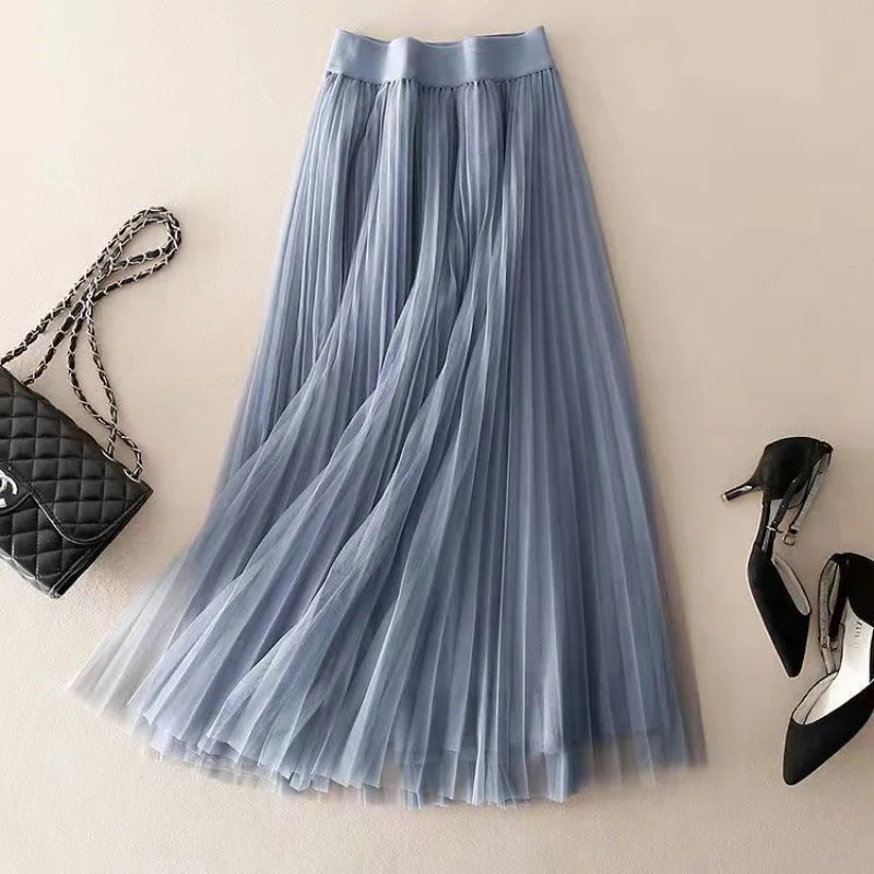 Chic women's high-waisted pleated A-line midi skirt, a versatile piece for sophisticated casual or formal looks.