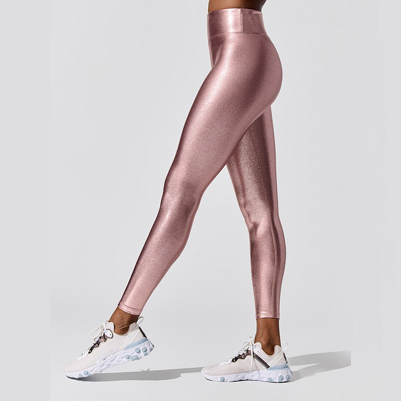 Woman wearing comfortable high-waist stretch leggings, perfect for everyday style & activewear.