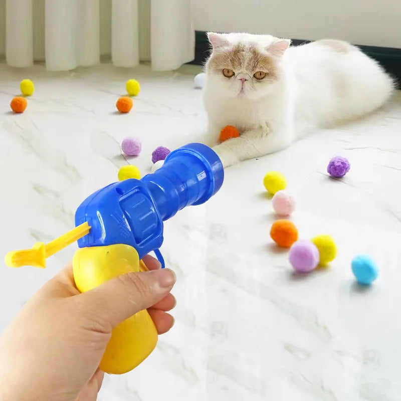Interactive Cat Toy Cannon launching small toys for engaging pet playtime. Durable & fun hunting toy for active cats.