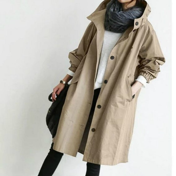Elegant women's oversized hooded trench coat. Versatile fall outerwear, perfect trendy long jacket for any figure.