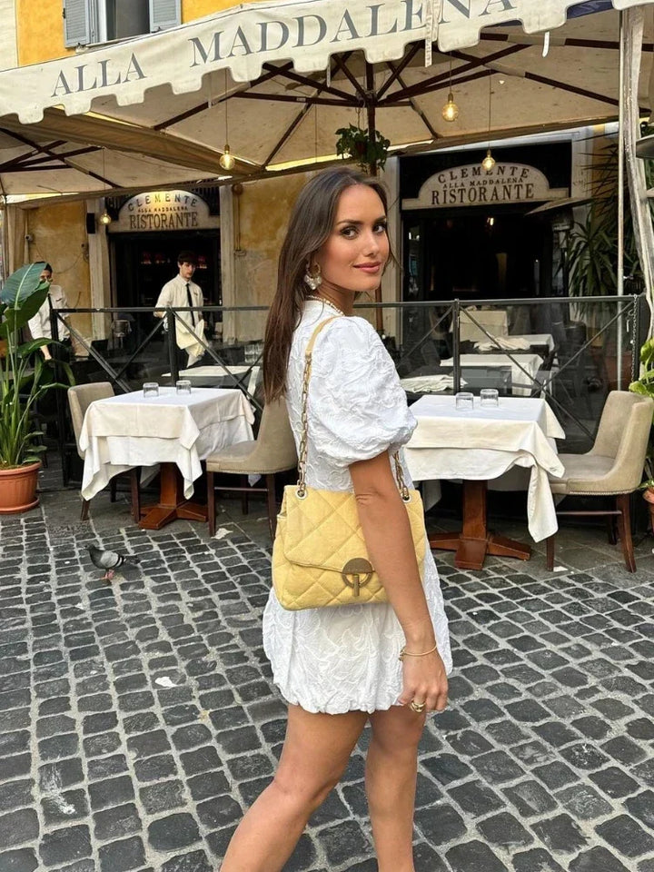 White floral mini dress for women, featuring a romantic print, puff sleeves, and a comfortable, elegant fit.