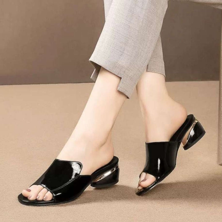 Chic women's glossy slides, offering comfort and elegance for summer outfits and versatile wear.