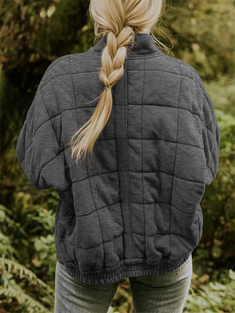 Modern women's quilted zipper jacket, a lightweight and stylish option for transitional spring and fall weather.