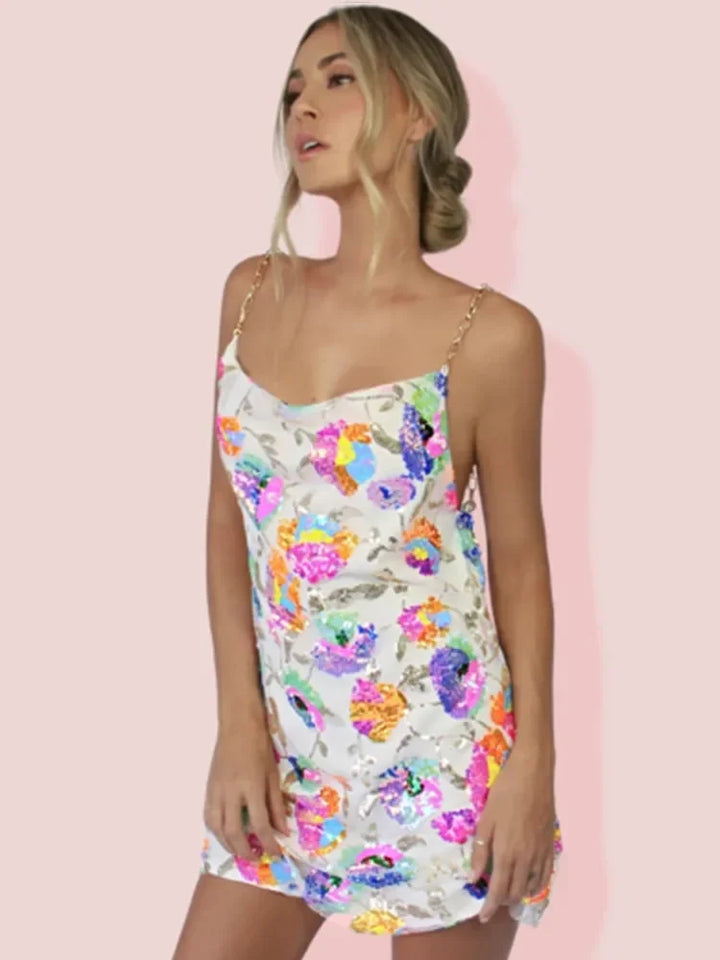 Feminine floral spaghetti strap mini dress for women, vibrant summer style, party & vacation wear.