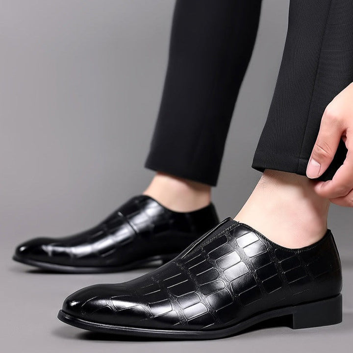 Fashionable men's glossy crocodile pattern slip-on dress shoes, offering sleek style for office wear and events.