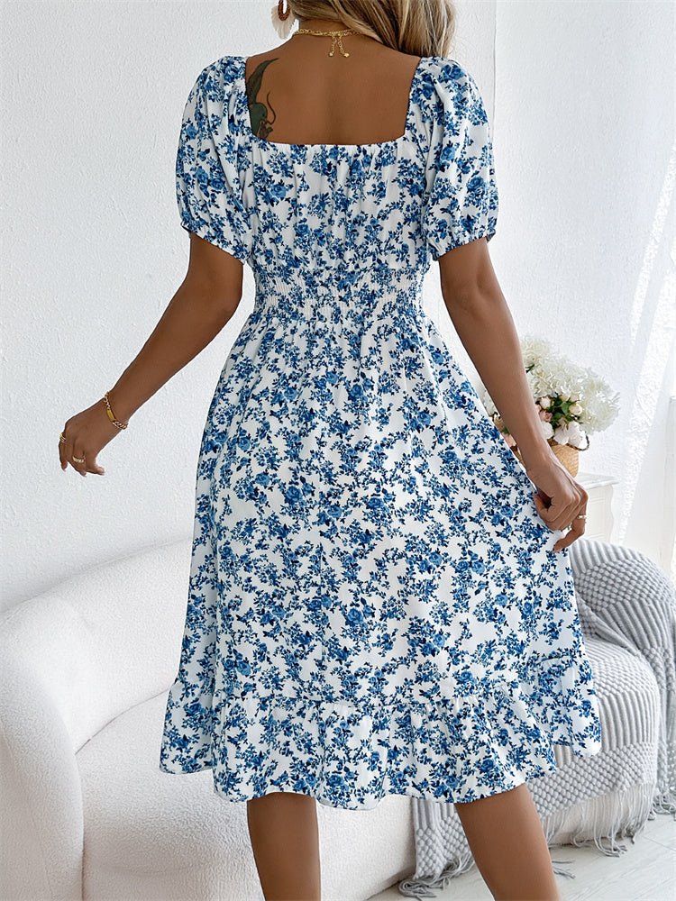 Floral smocked midi dress with puff sleeves, square neckline. Chic women's fashion for any season.