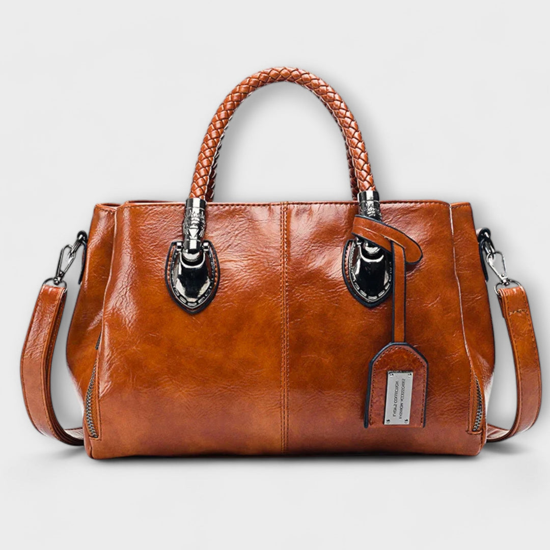 Elegant unisex leather duffle bag for travel & work. Classic design, perfect everyday carry.
