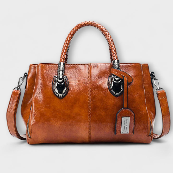 Elegant unisex leather duffle bag for travel & work. Classic design, perfect everyday carry.