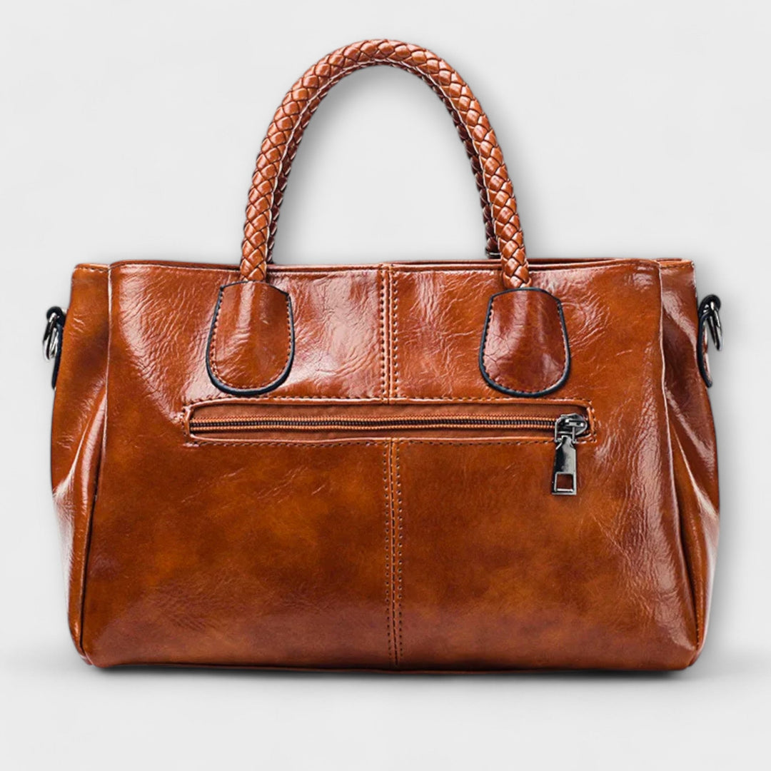 Stylish unisex leather duffle bag, an elegant companion for travel adventures & professional work.