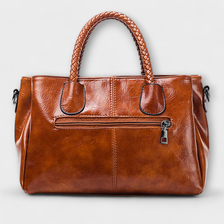 Stylish unisex leather duffle bag, an elegant companion for travel adventures & professional work.