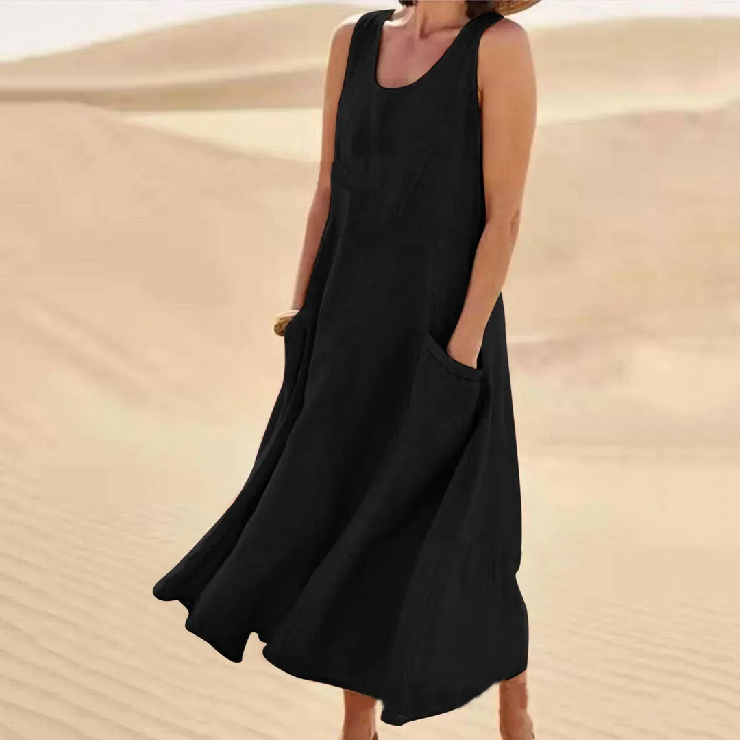 Loose fit sleeveless dress for women, with practical pockets; great for vacation or daily wear.
