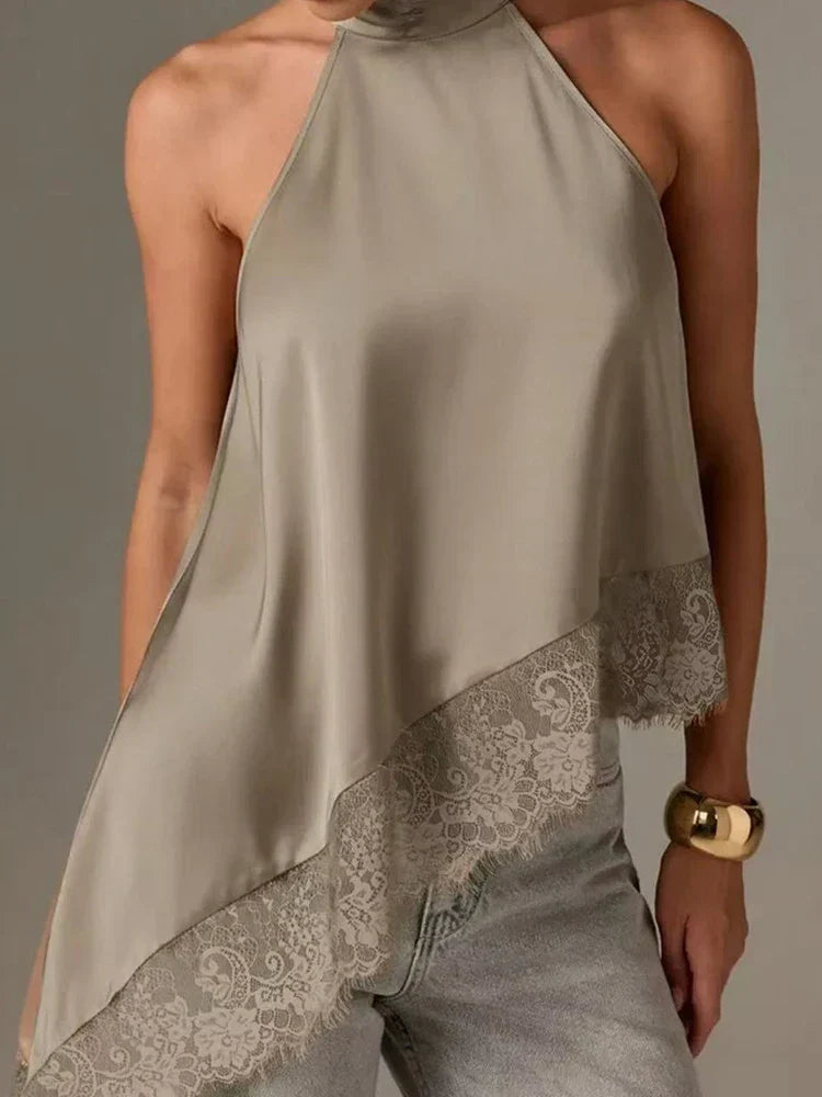 Stylish sleeveless women's top featuring an elegant halter design and fashionable asymmetric lace trim.