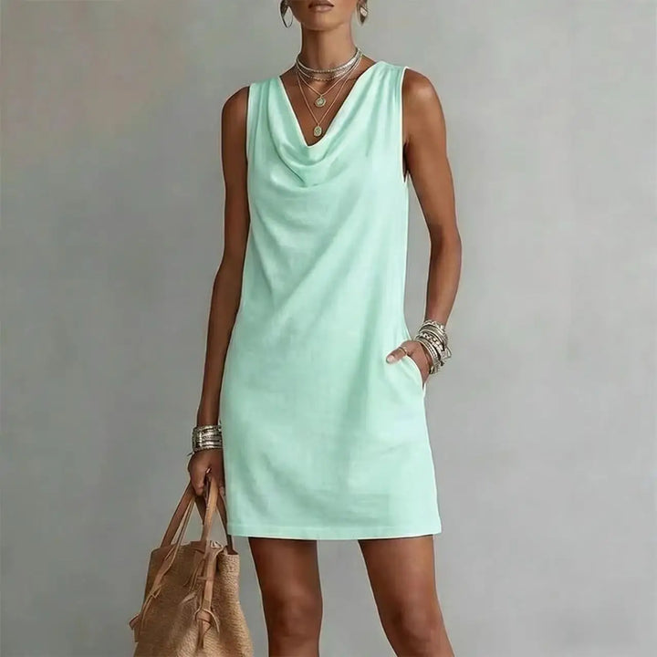 Comfortable sleeveless cowl neck mini dress for women, an A-line style with pockets for everyday summer fashion.