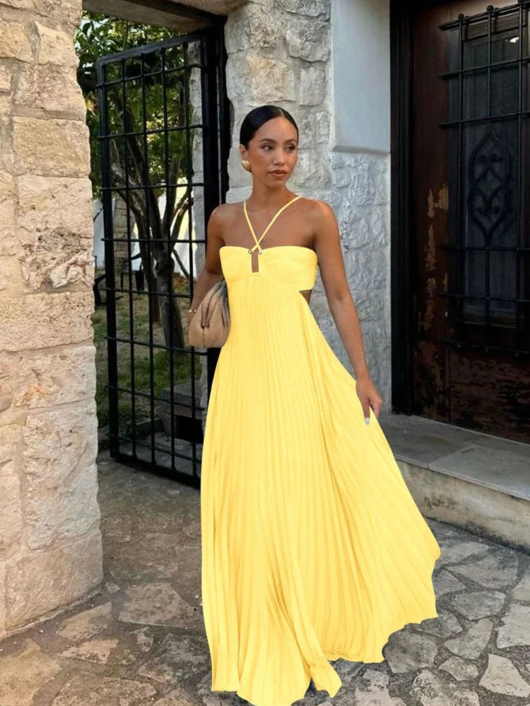Stylish women's long pleated maxi dress. Elegant flowy design, perfect for special occasions.