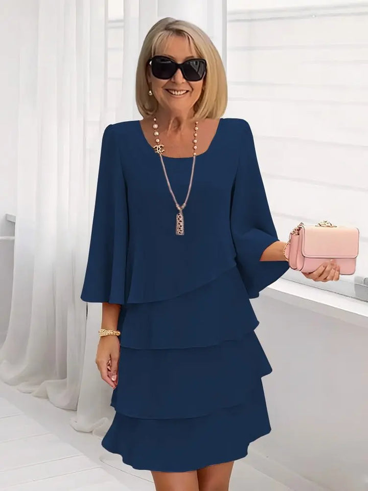 Stylish navy A-line comfort dress for women with elegant ruffles. Versatile midi length, ideal for various occasions.
