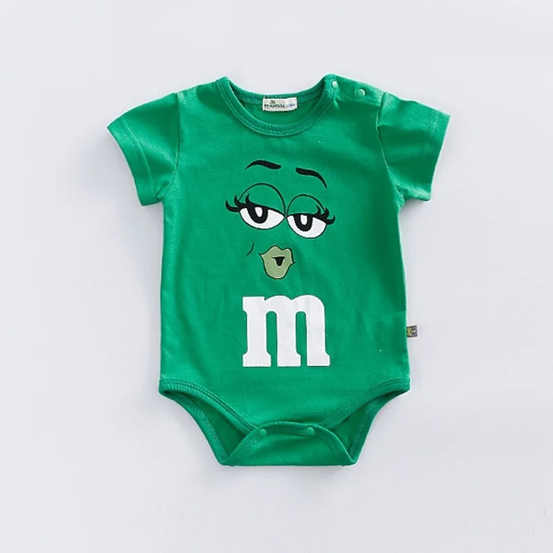 Colorful baby romper with playful M&M faces, short sleeve, perfect for summer casual wear.
