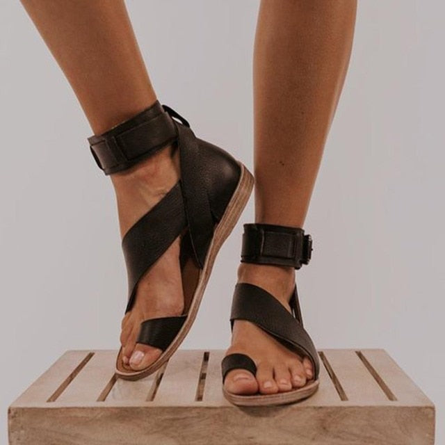 Stylish women's orthopedic sandals: elegant cross strap, toe ring, offering foot pain relief & comfort.