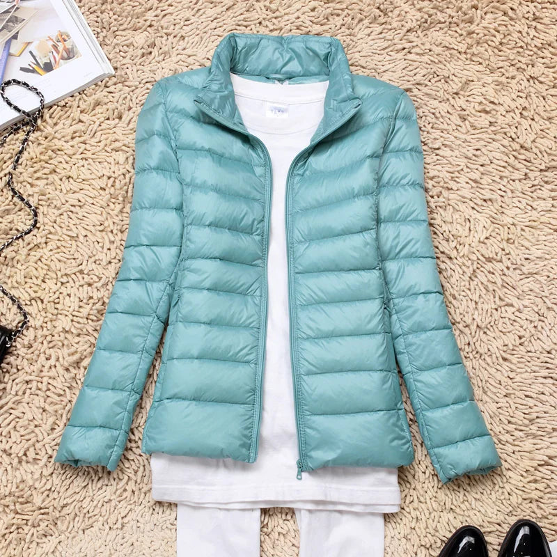 Insulated women's jacket with a hood, ultra-light. Essential winterwear, weather-resistant & cozy.