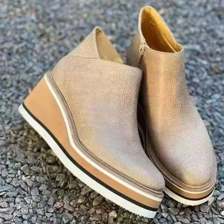 Women's stylish ankle boots with side zipper, offering orthopedic comfort.