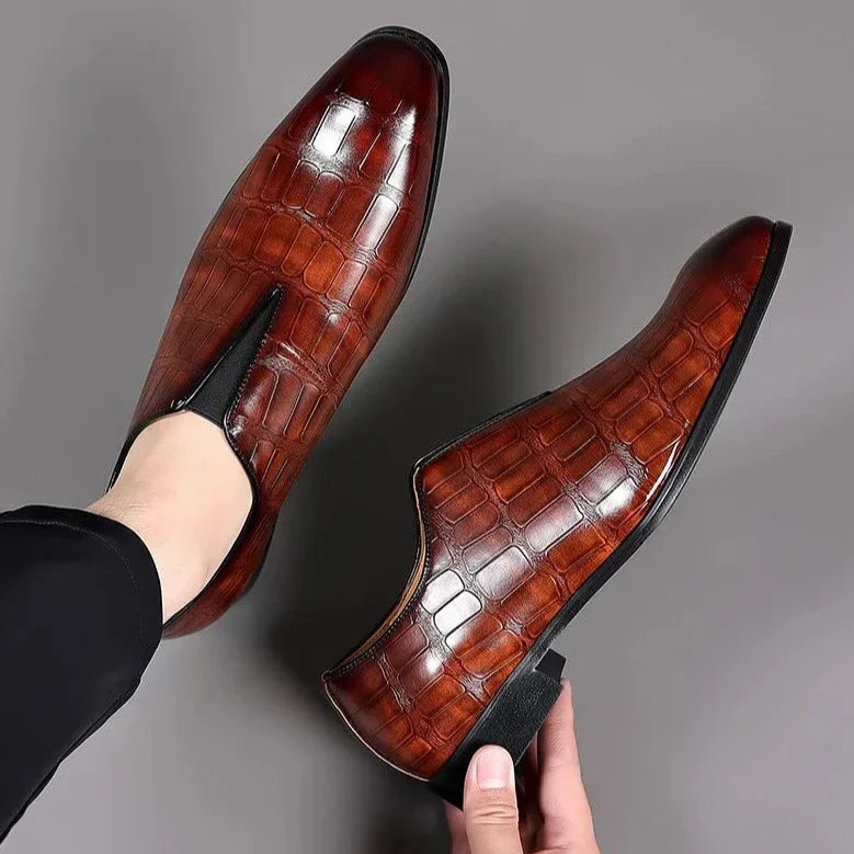 Stylish men's slip-on brogues with a luxurious glossy crocodile pattern, perfect for smart casual and events.