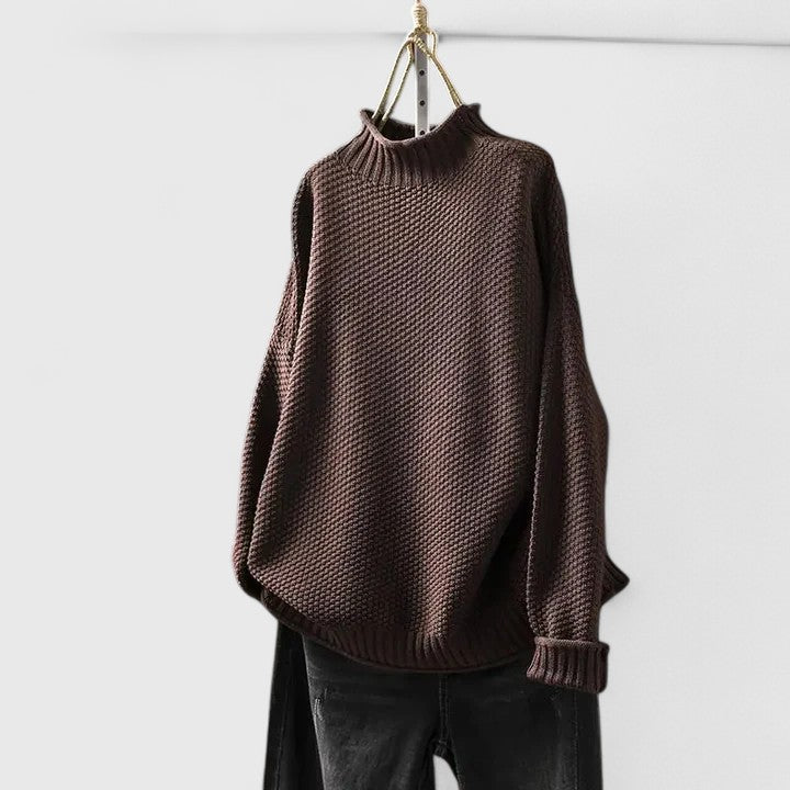 Full length shot of a woman wearing a relaxed fit textured mock neck jumper, ready for fall & winter.