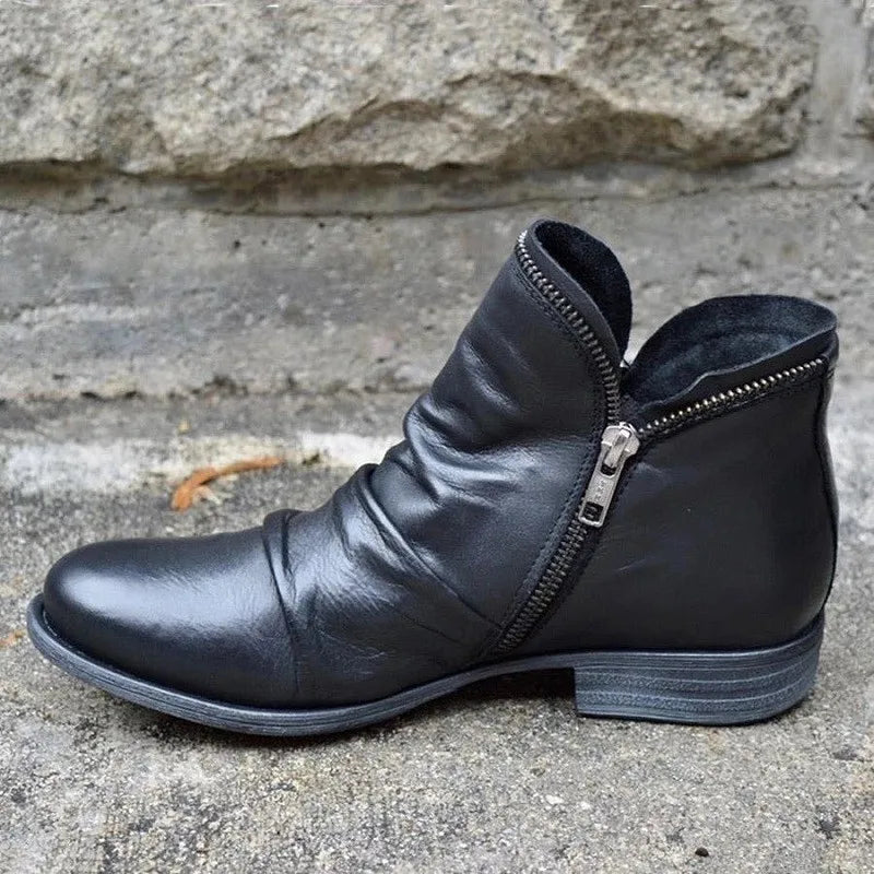 Black leather women's ankle boots with orthopedic arch support, perfect for everyday style.