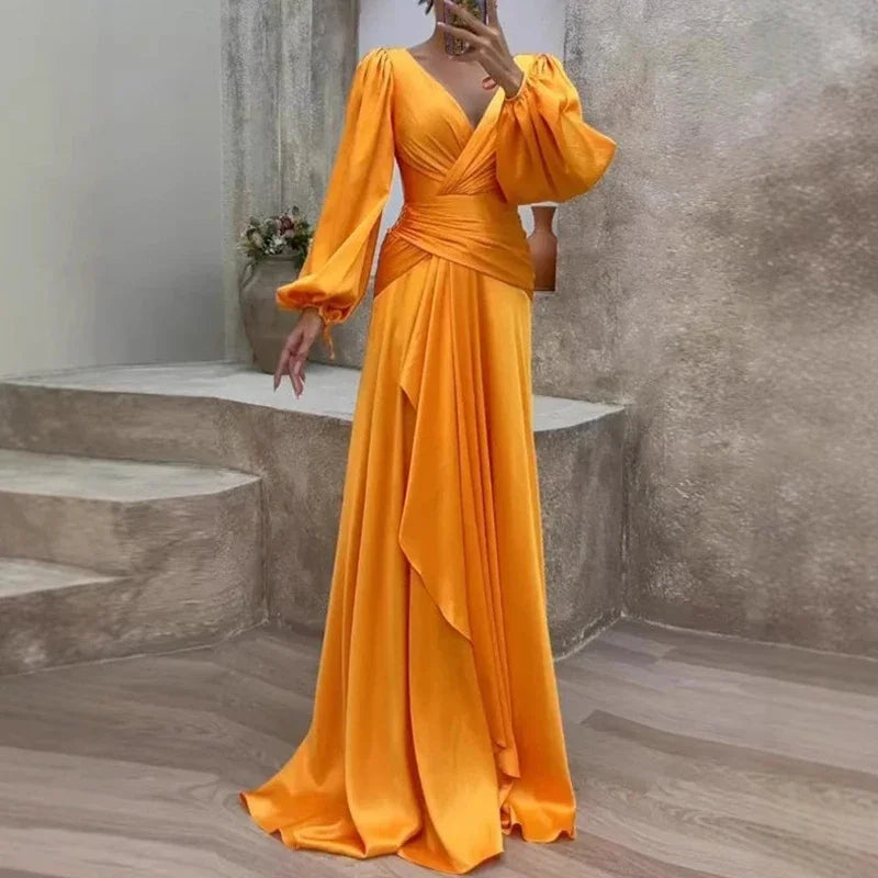 Stylish yellow flowing maxi dress for women. An elegant formal gown, perfect for any special occasion or evening event.
