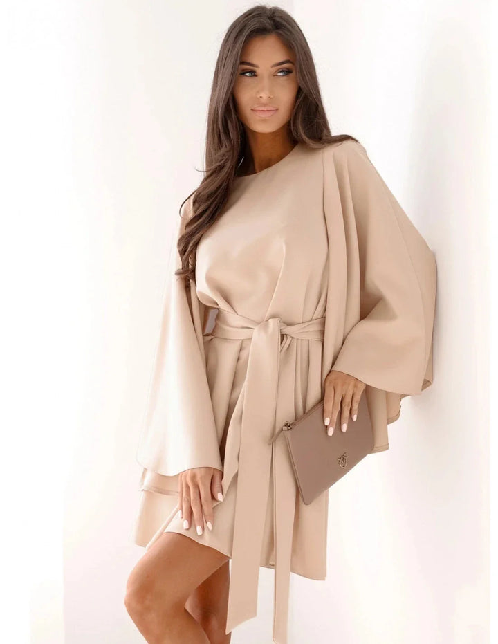 Women's elegant solid long-sleeve mini dress. A chic and versatile fall fashion piece for any event.