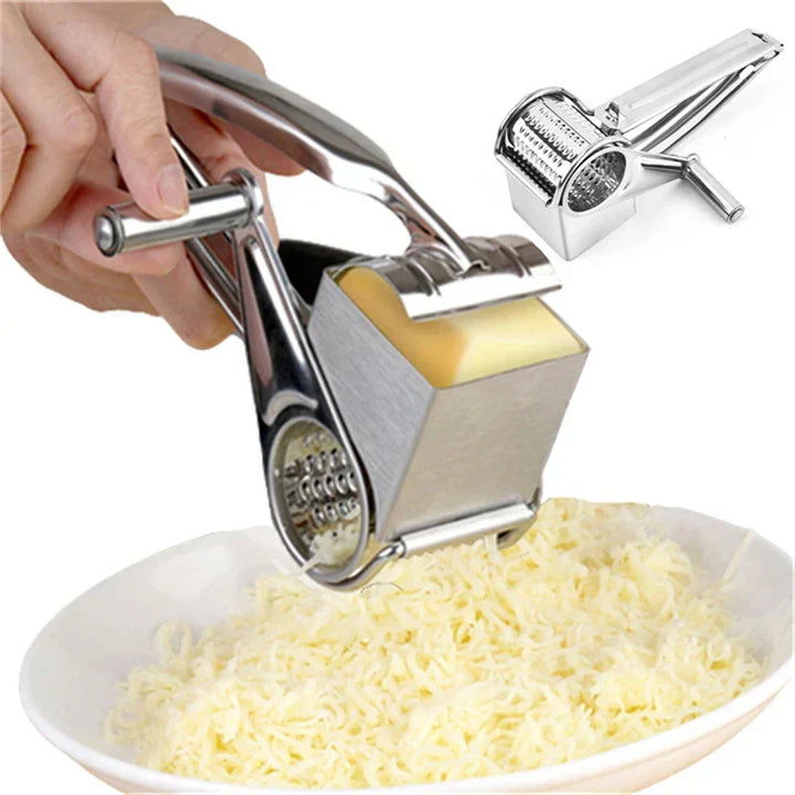 Manual rotary cheese grater for effortless shredding of cheese, nuts, and chocolate. Stainless steel kitchen tool.