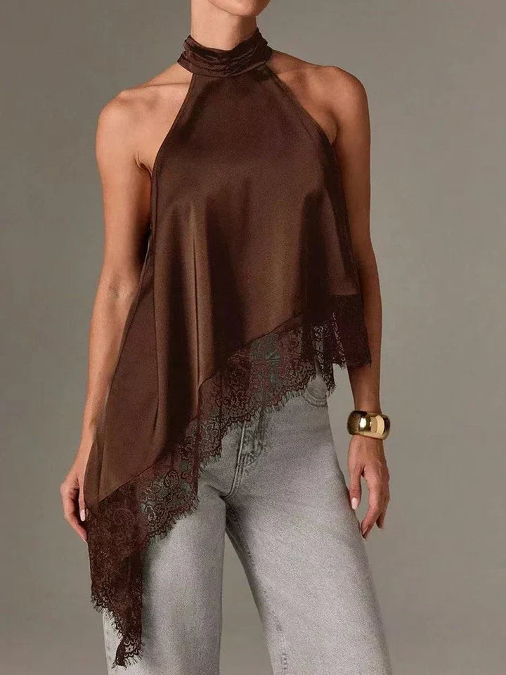 Contemporary women's halter blouse with elegant asymmetric lace details, perfect for summer fashion.