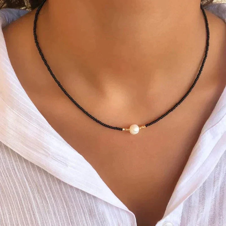 Elegant women's handmade freshwater pearl necklace, a beautiful piece of pearl jewelry for any occasion.