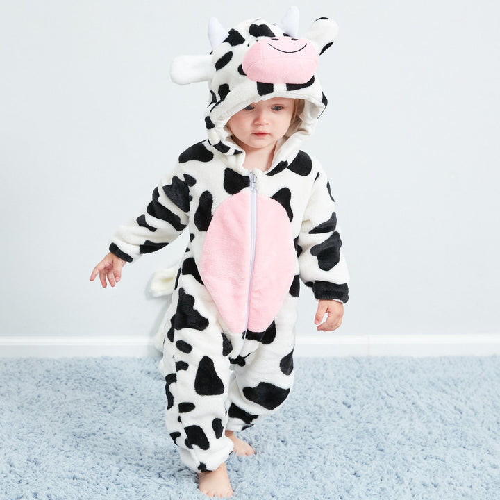 Cheerful cow print animal onesie for kids. Warm, soft baby pajama or toddler sleepsuit for cozy nights.