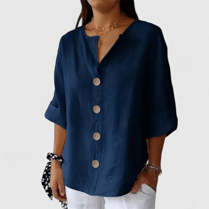 Versatile women's V-neck button-front blouse styled for elegant workwear & casual spring/summer fashion.