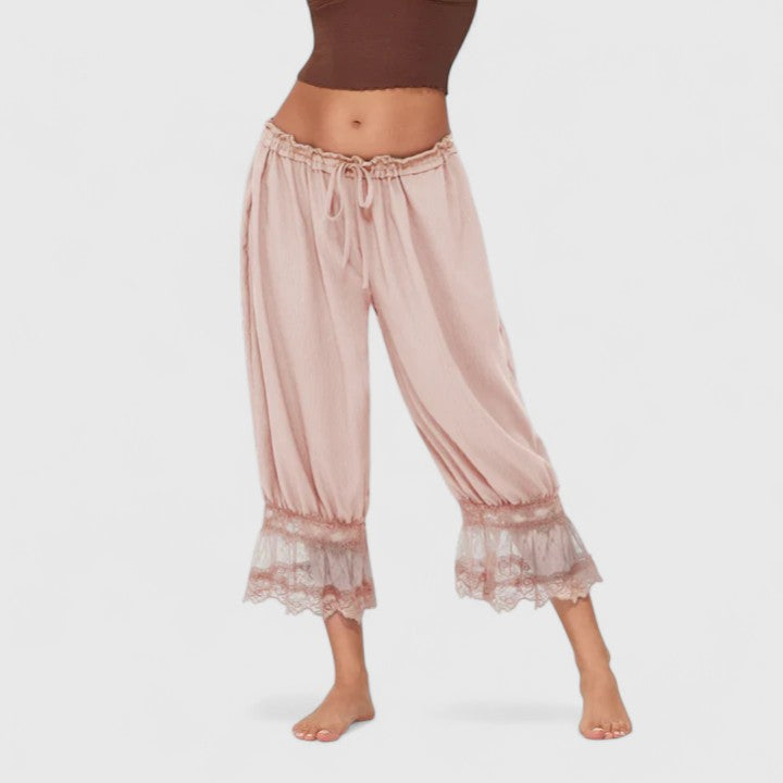 Women's loose fit trousers with subtle lace detail, offering comfort and everyday style.