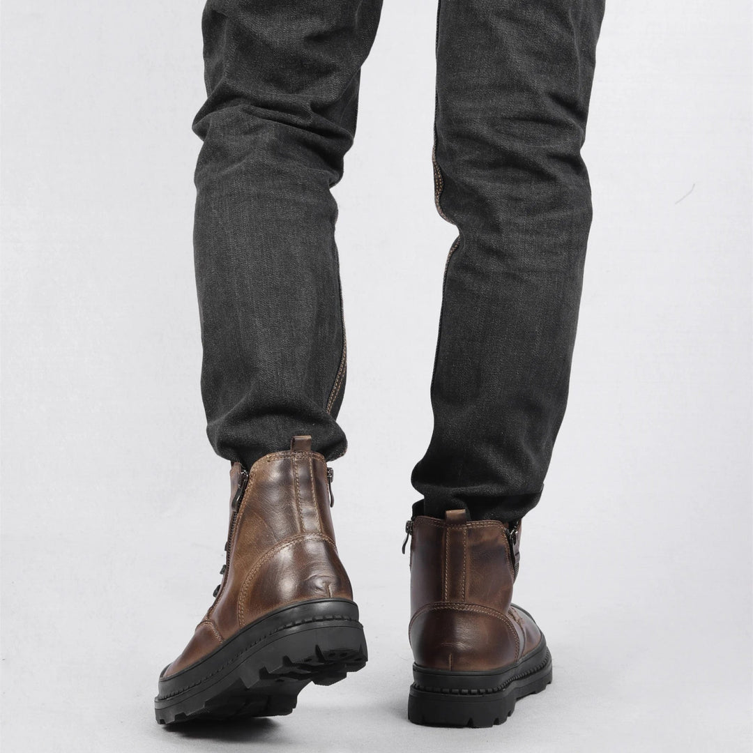 Men's vintage lace-up combat boots featuring a convenient side zip. Durable leather for all-day wear.
