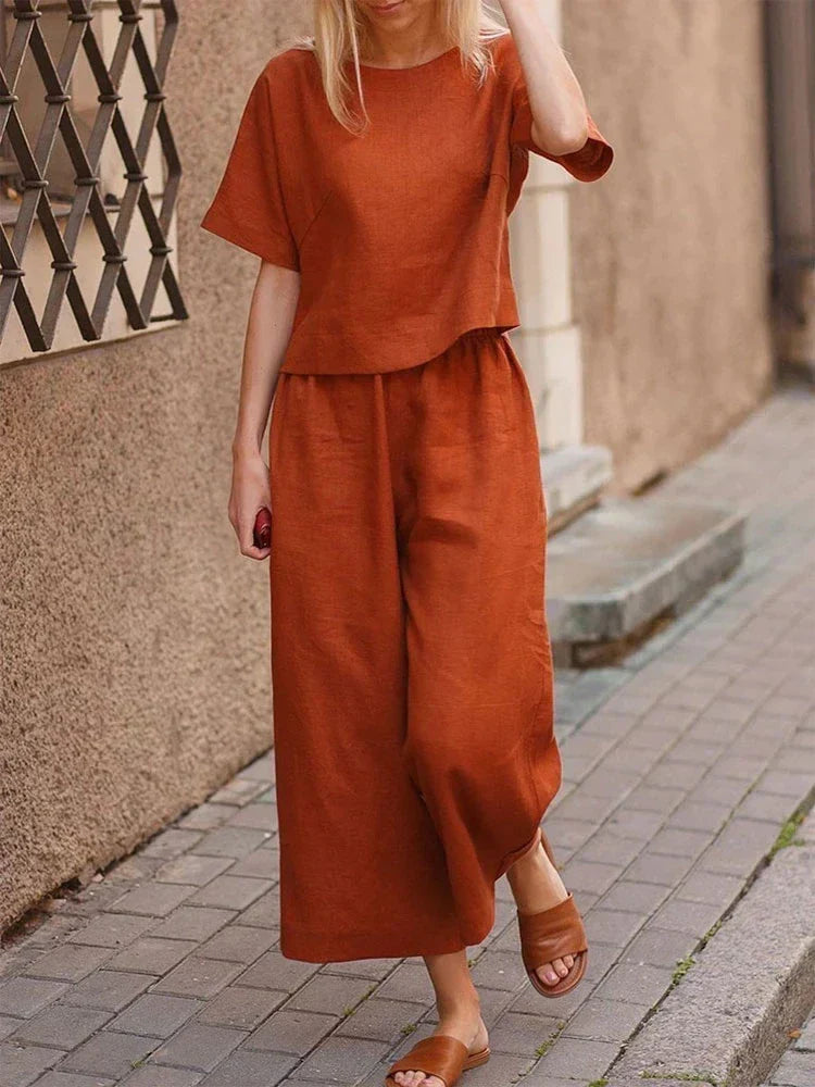 Women's relaxed fit linen two-piece set, with wide-leg pants and a matching top, perfect for summer casual wear.