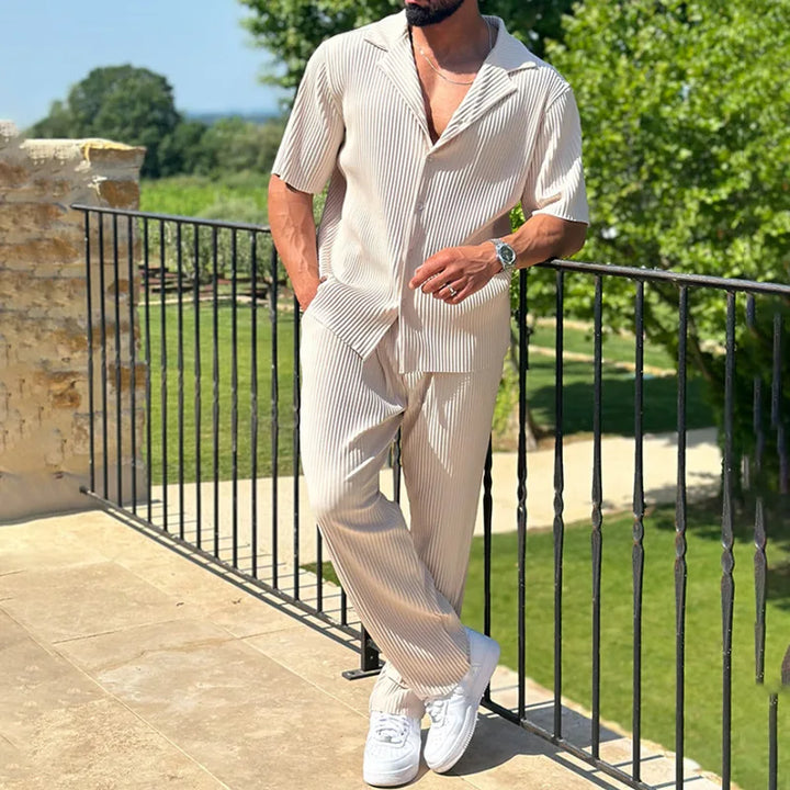 Comfortable men's relaxed fit pleated short sleeve shirt & trousers set, ideal for summer casual wear.